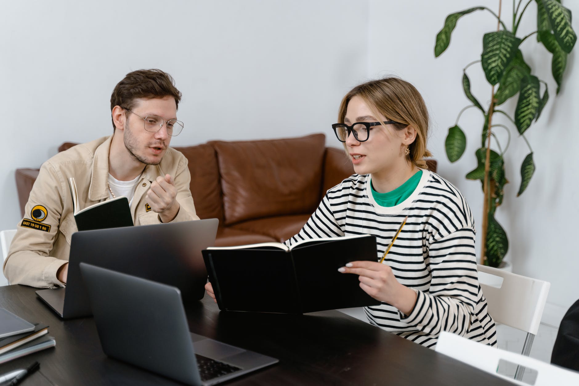 Man and woman reading book