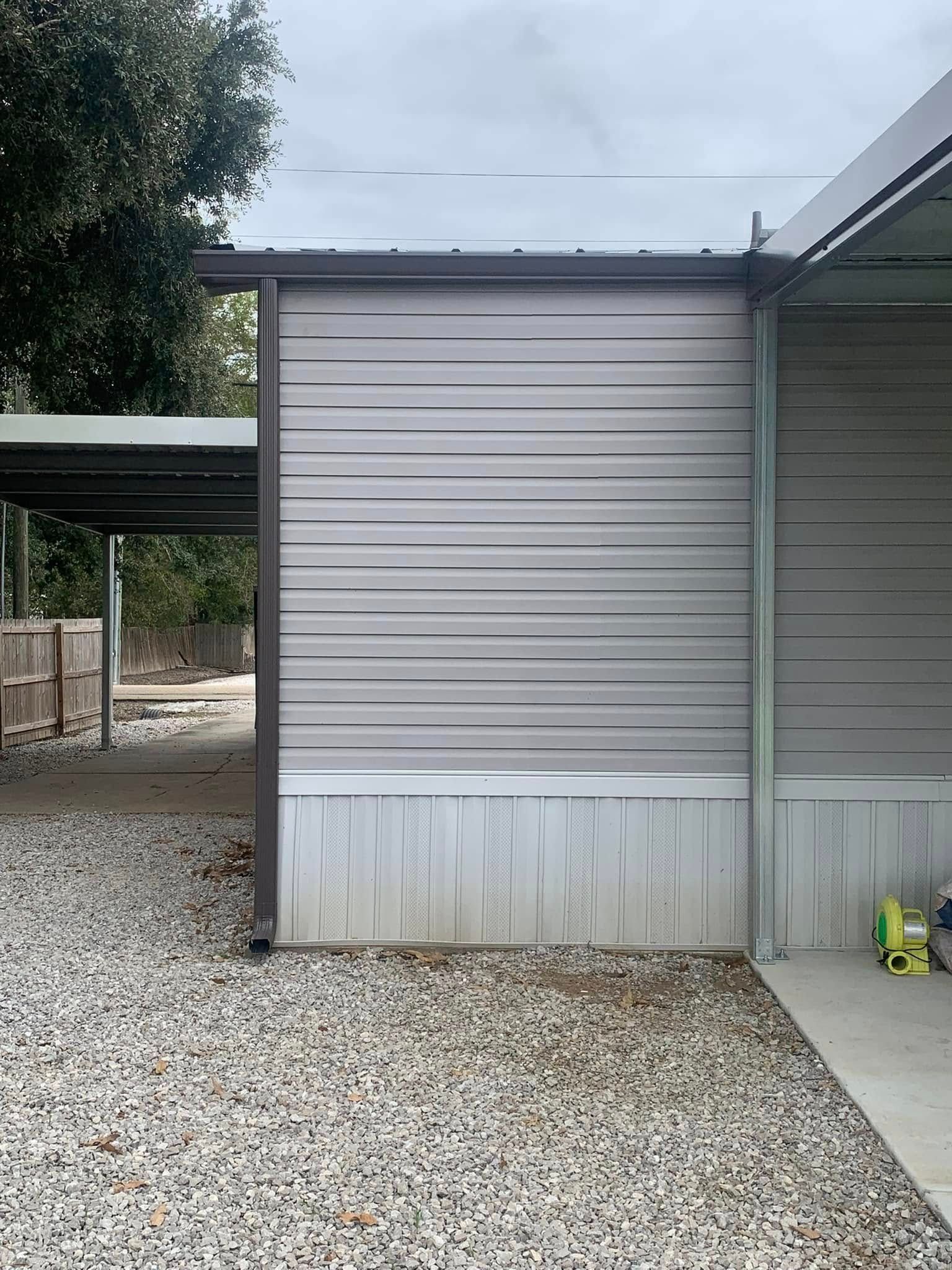 A mobile home with a carport attached to it.