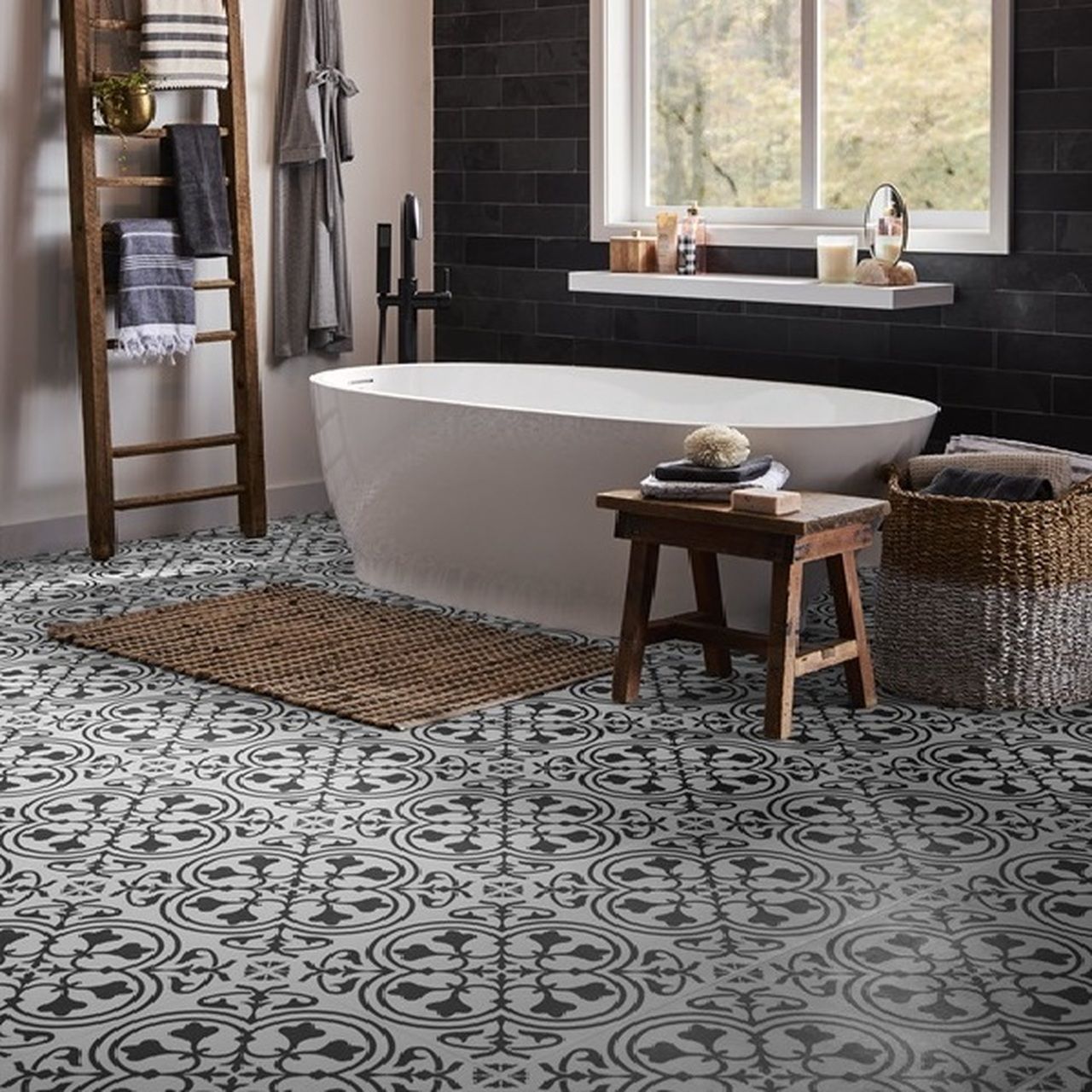 Bathroom with patterned floor, white tub, dark accent wall, and wooden accents.