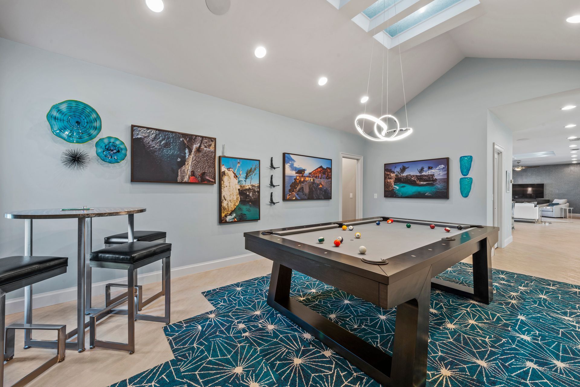 There is a pool table in the middle of the room.