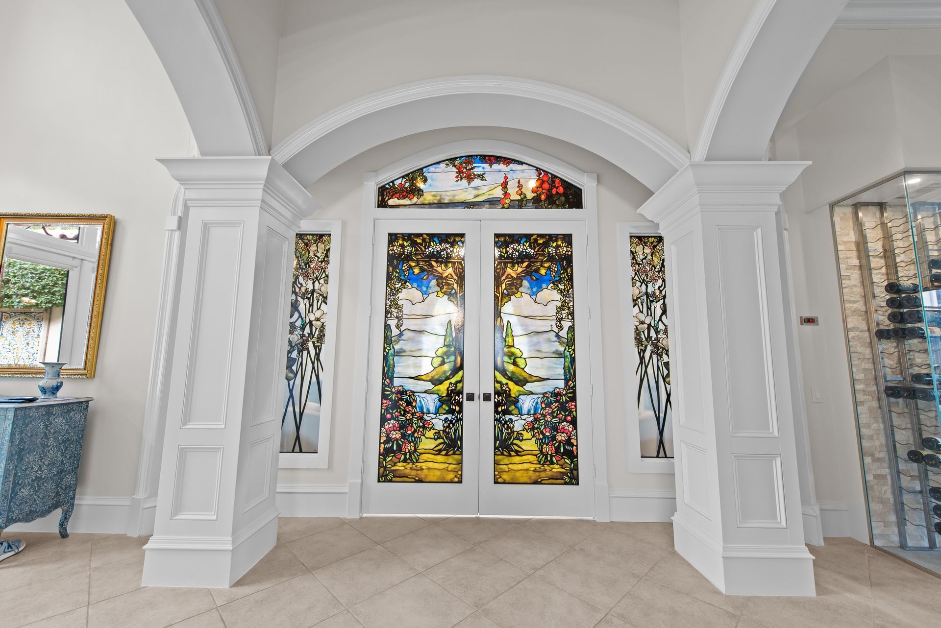 There is a stained glass door in the middle of the room.