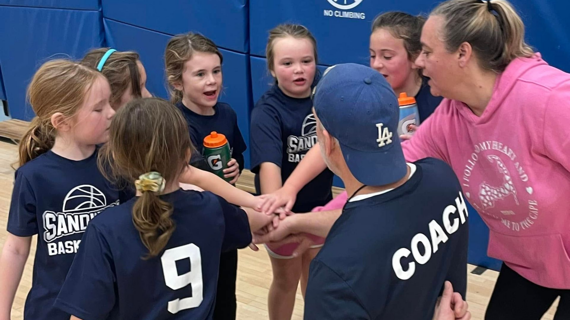 Youth basketball team huddle