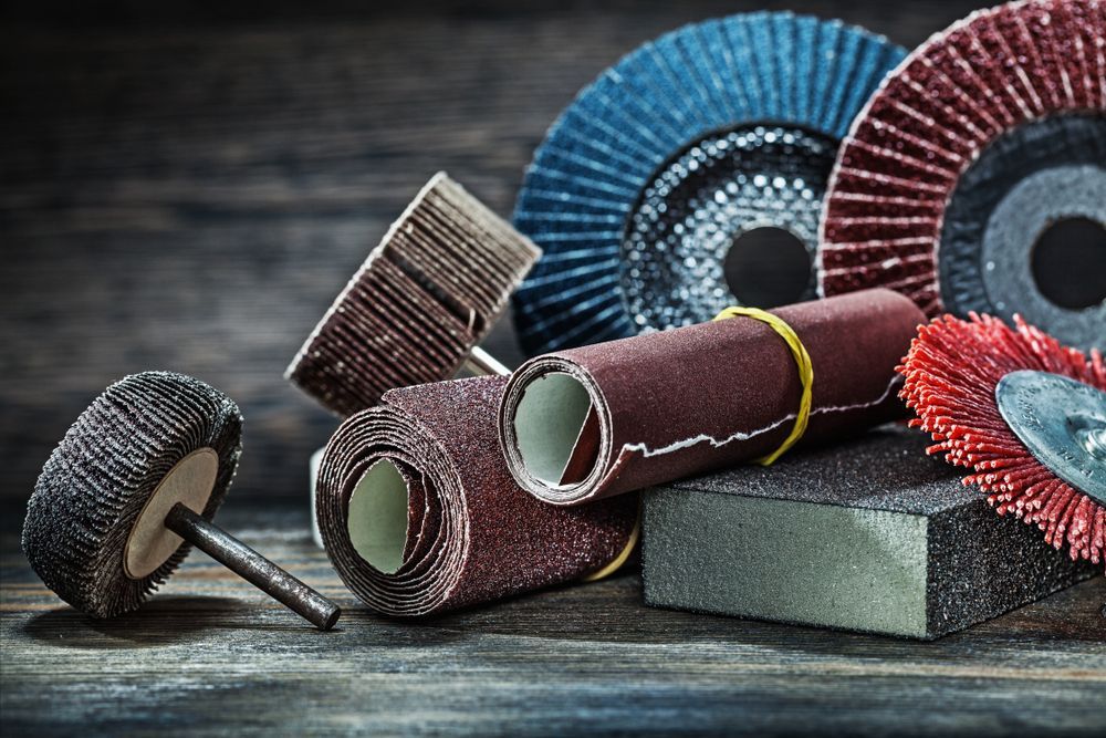 There Are Many Different Types Of Sanding Discs On The Table — Illawarra Fasteners Pty Ltd In Unanderra, NSW