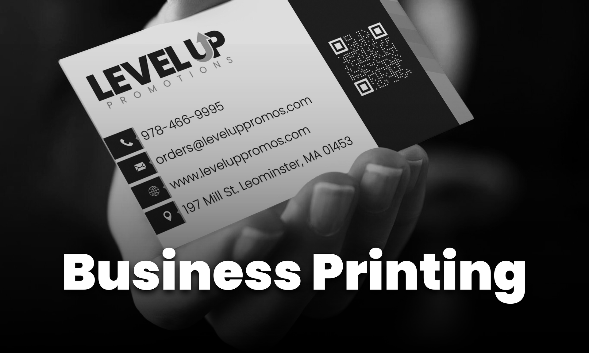 Business card held by hand;
