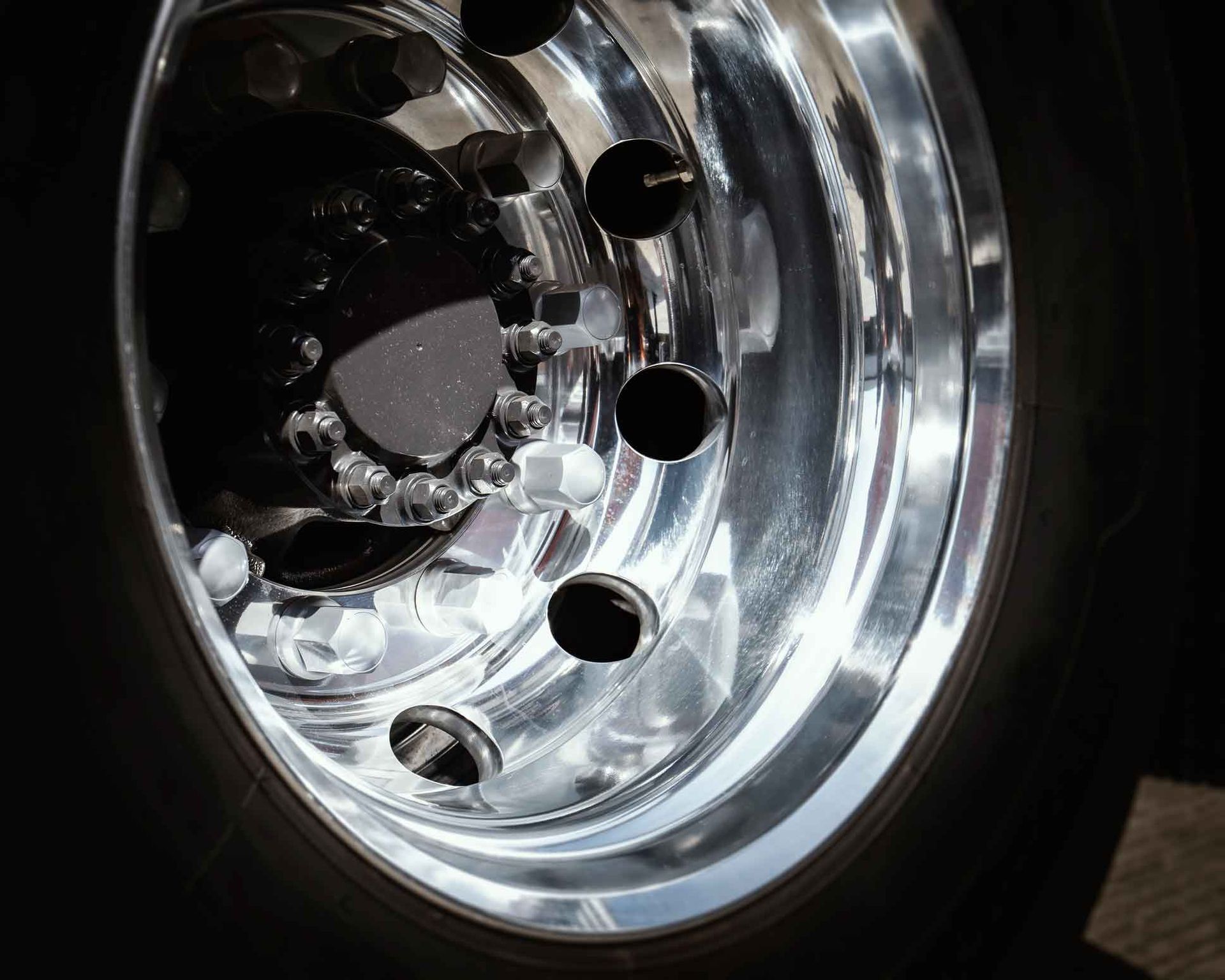 A Close Up Of A Chrome Wheel On A Black Tire – Delacombe, VIC - Transport Tyres