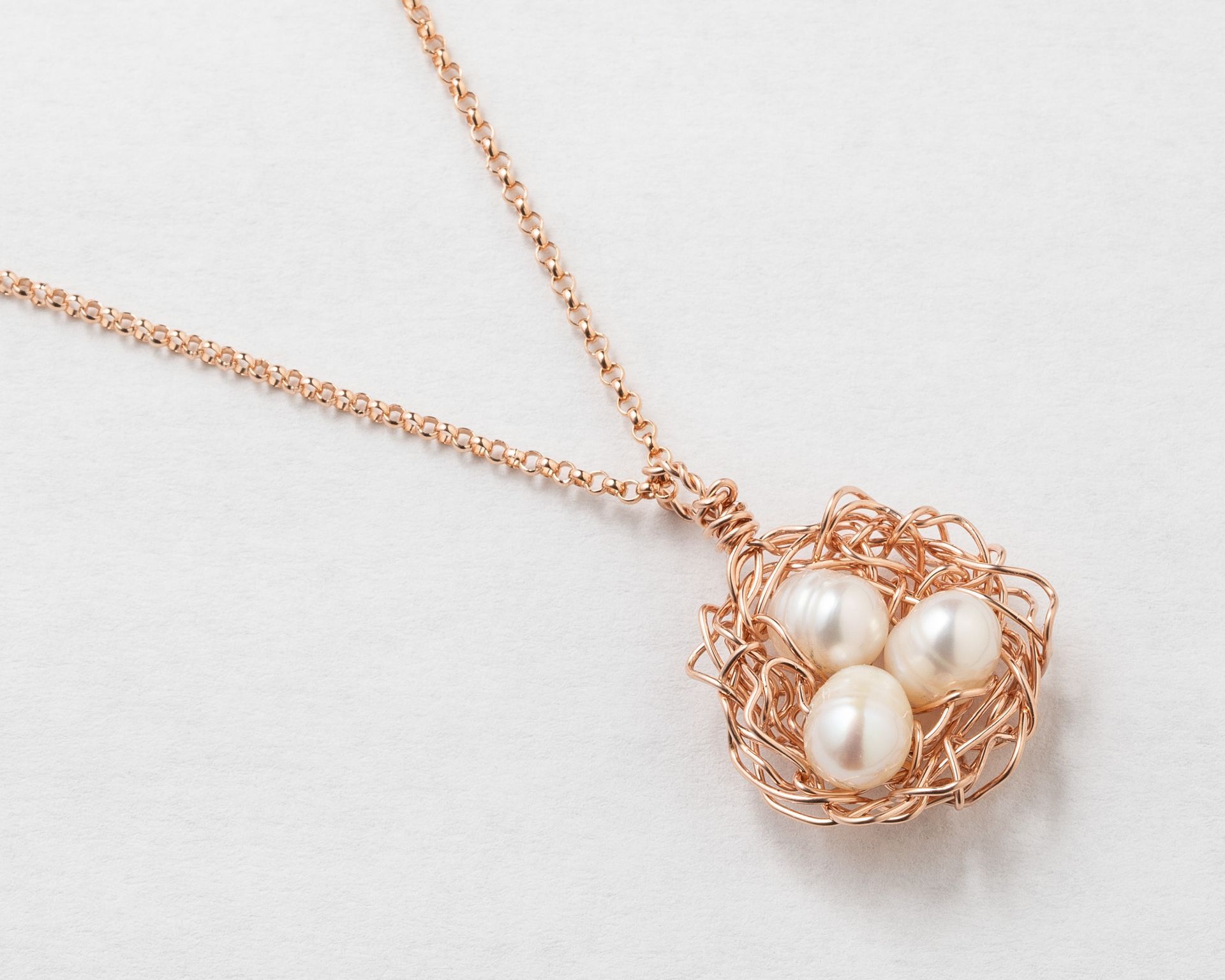 Compass pendant necklace, symbolizing direction and guidance.