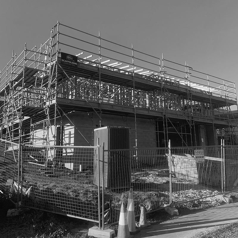 A Black and White Photo of a Building Under Construction — RM Scaffolding Solutions in Ballina, NSW