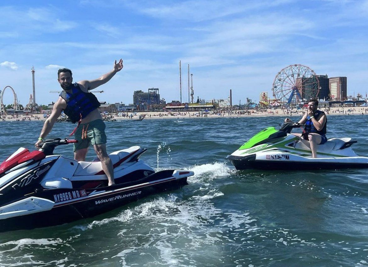 two people enjoying jet skis in new york