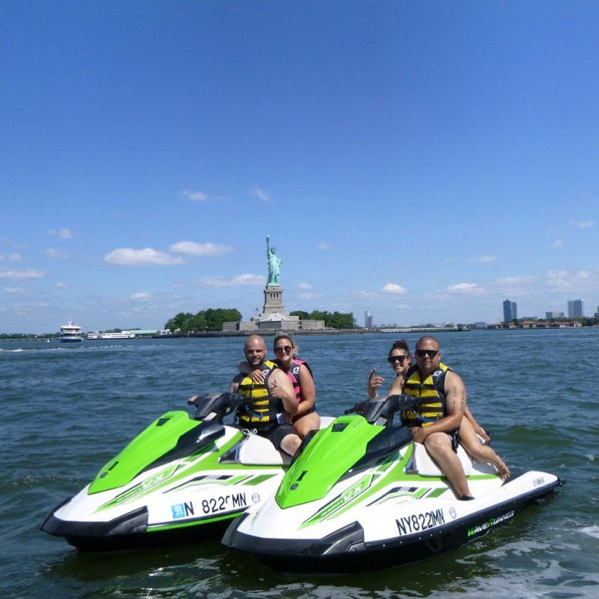 couple enjoying their time riding on jet ski
