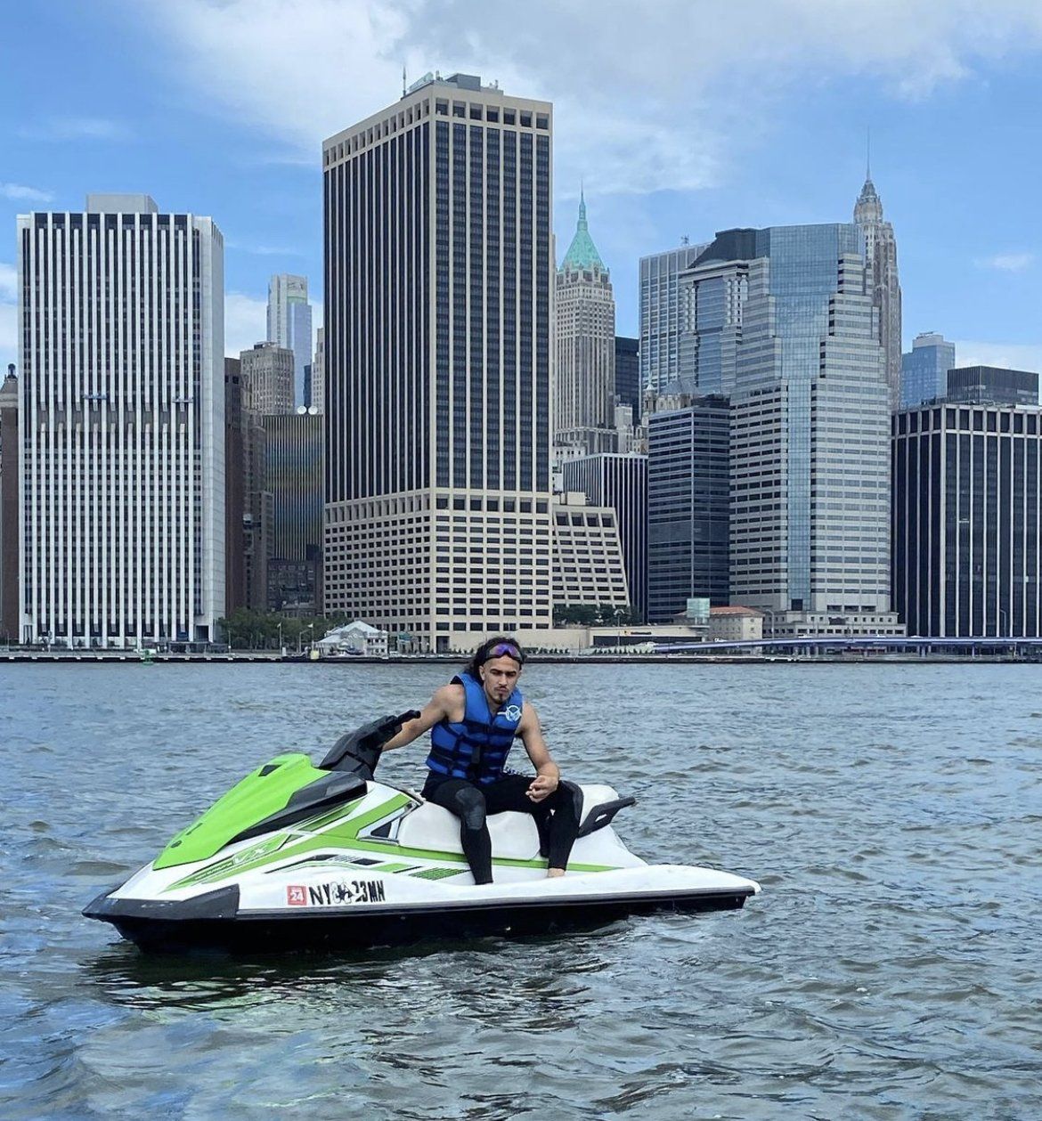 man sitting on green jet ski in New York