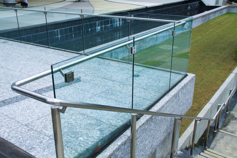 A Staircase With a Glass Railing and a Stainless Steel Railing — Top Shelf Glass Pool Fencing & Balustrading in Brisbane, QLD