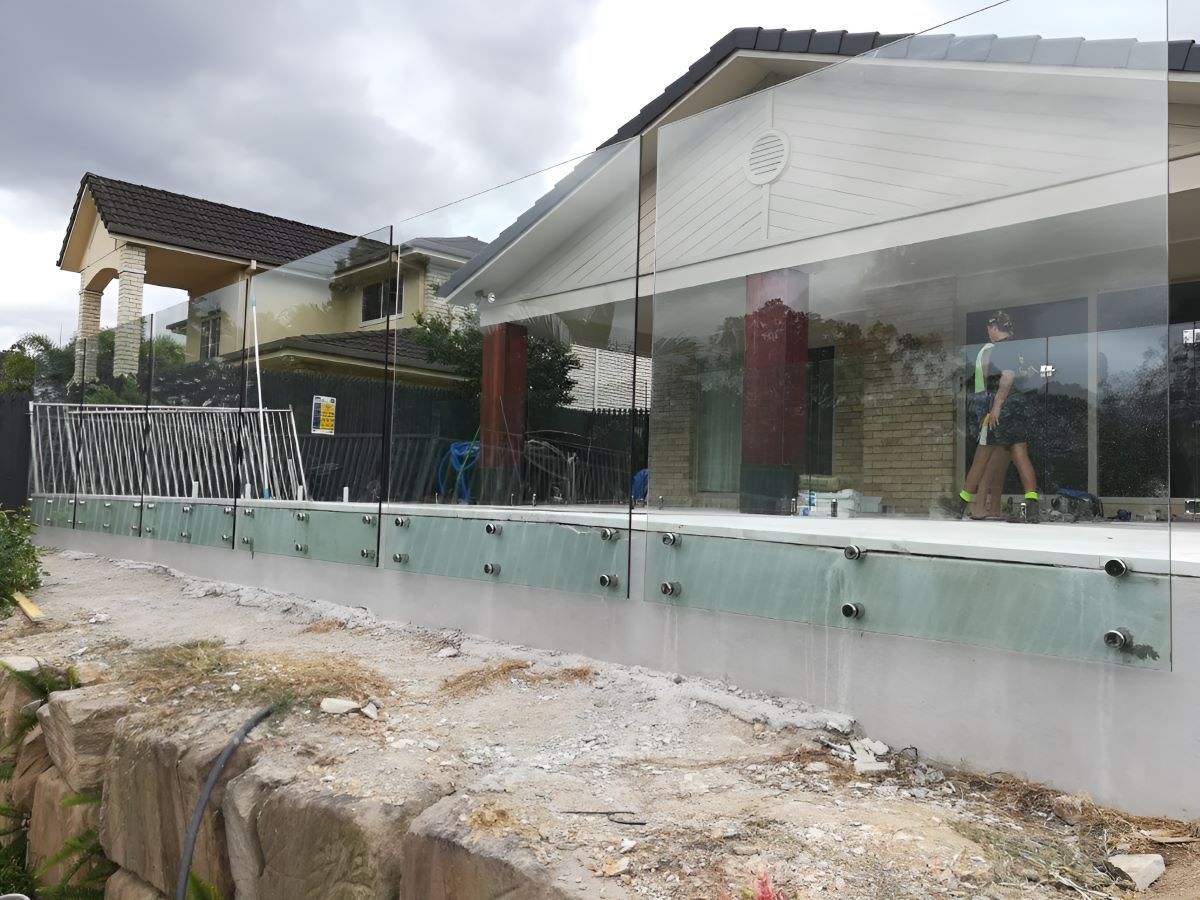 Glass Railing With Metal Hardware — Top Shelf Glass Pool Fencing & Balustrading in Merrimac, QLD