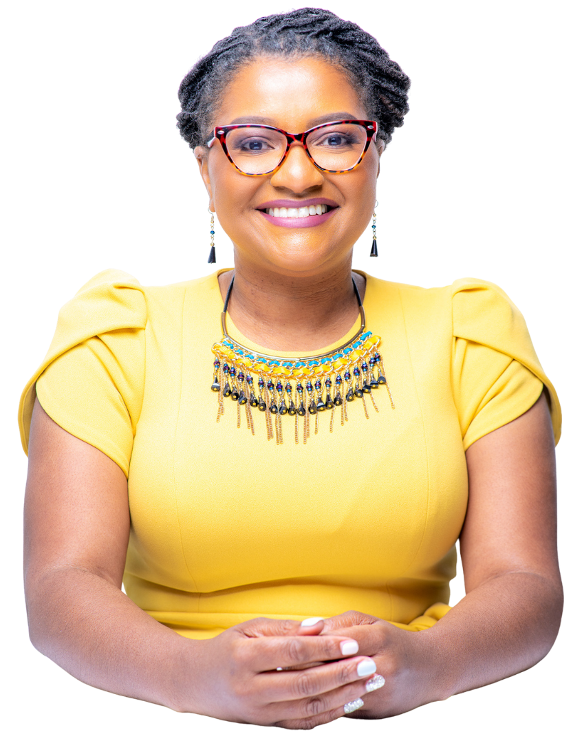 Olivia Smith wearing glasses and a yellow shirt is smiling.