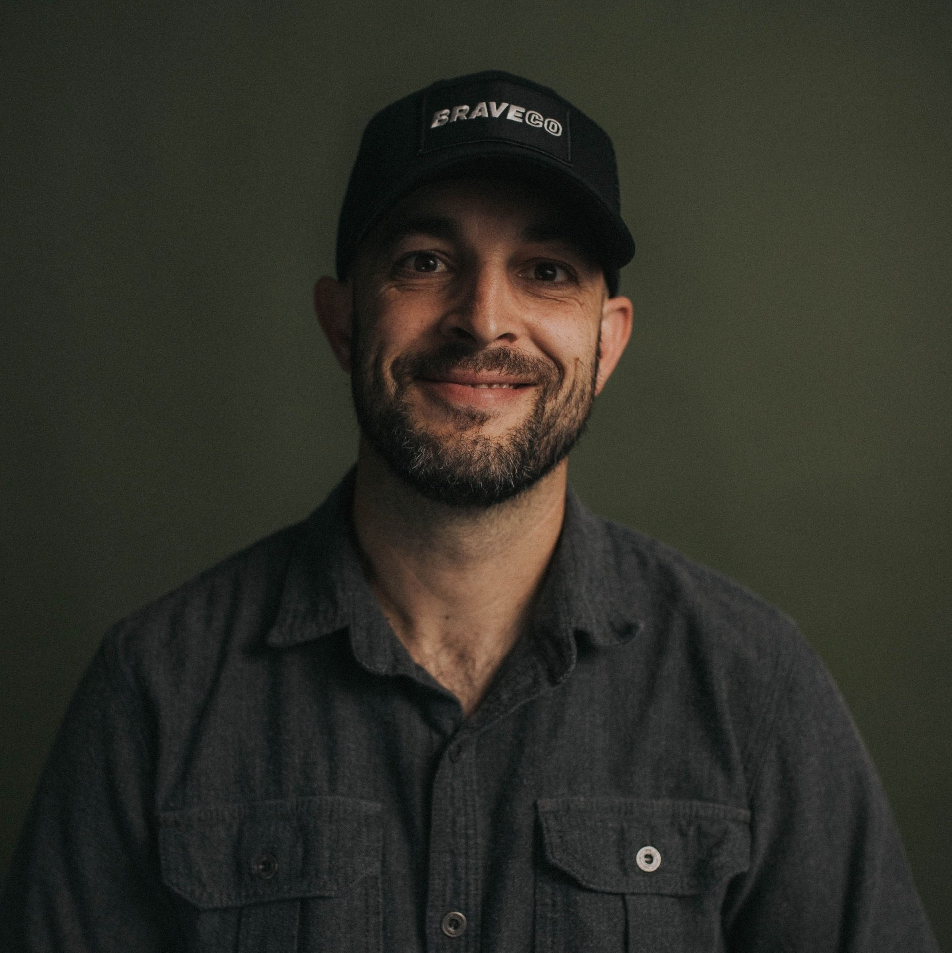 A man with a beard wearing a hat that says sesameye