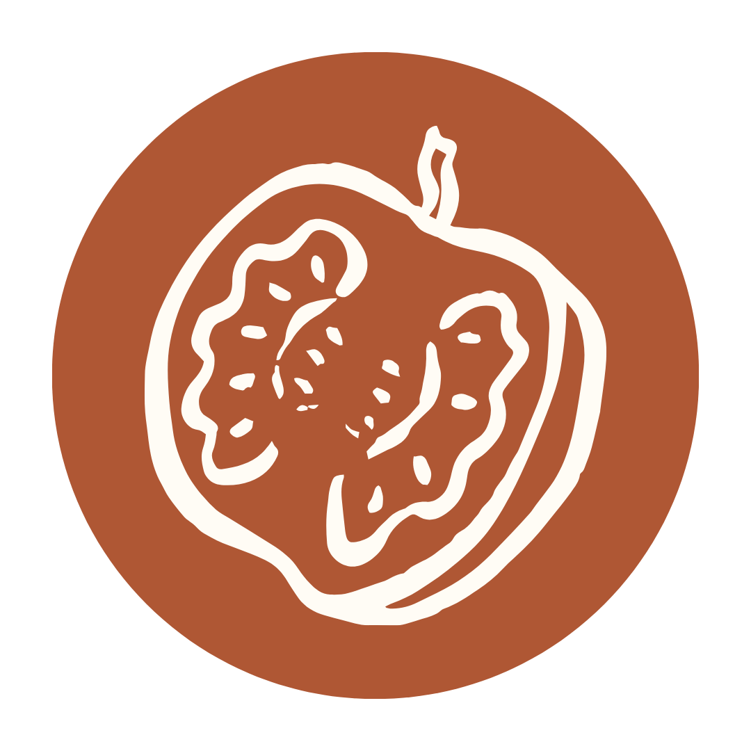 White line drawing of a halved pomegranate on a brown circular background