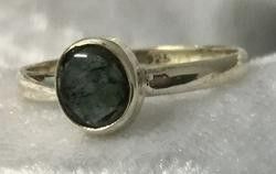 A Ring Featuring an Elegant Oval Green Stone — Crystal Cauldron In South Mackay, QLD