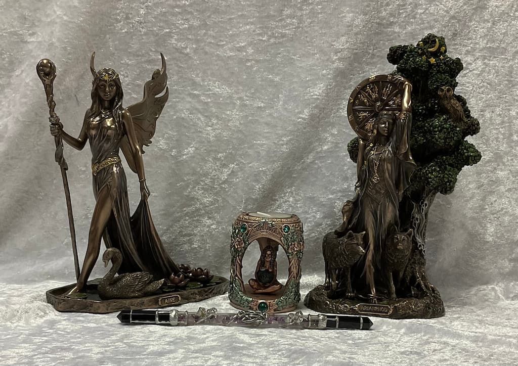 A Group of Statues Are Sitting on Top of A Table — Crystal Cauldron in South Mackay, QLD