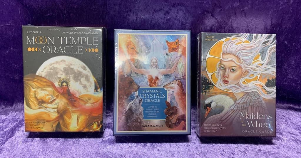 Three Tarot Cards Are Sitting on A Purple Table — Crystal Cauldron in South Mackay, QLD