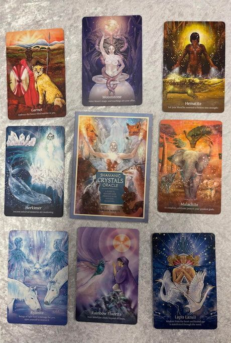 A Group of Tarot Cards Are Sitting on A Table — Crystal Cauldron in South Mackay, QLD