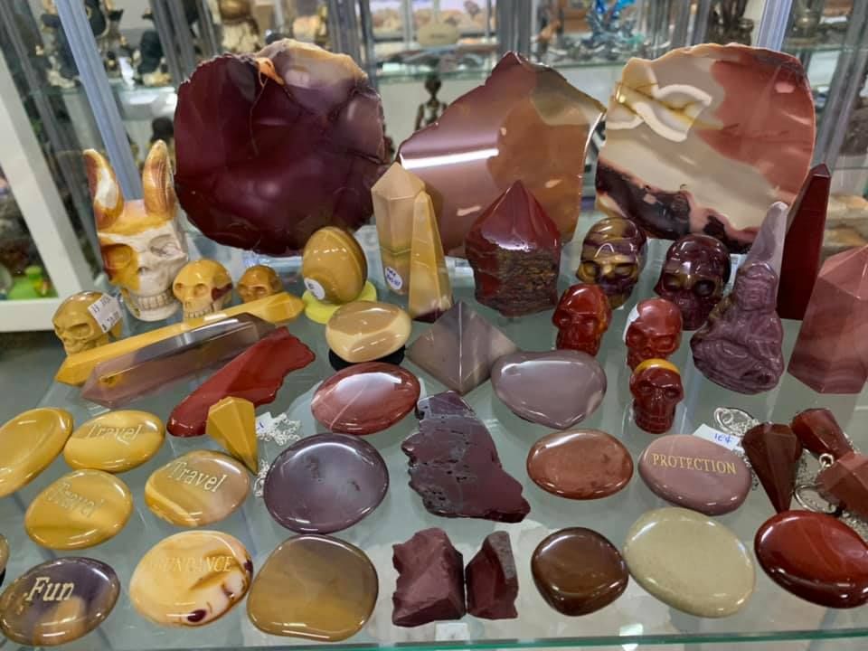 A Glass Shelf Filled with A Variety of Rocks and Skulls — Crystal Cauldron in South Mackay, QLD