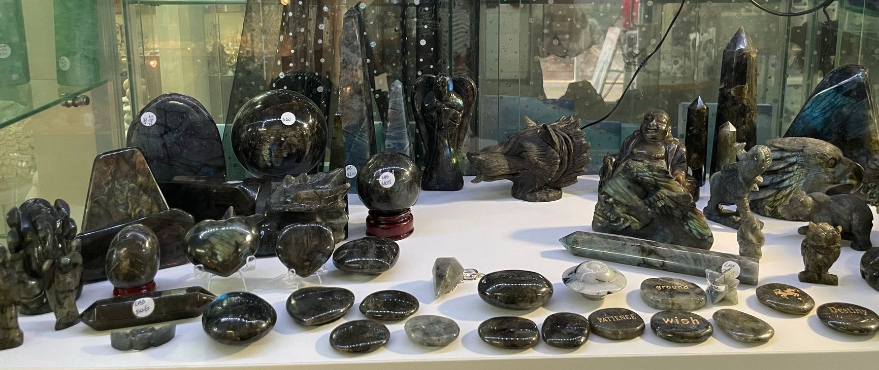 A Display Case with A Statue of A Fairy on Top — Crystal Cauldron in South Mackay, QLD