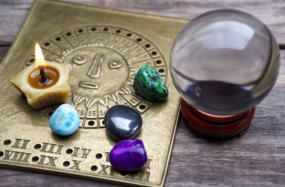A Crystal Ball , Candle , and Stones — Crystal Cauldron in South Mackay, QLD