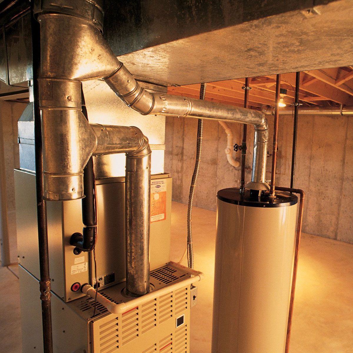 A basement with a heater and a water heater Residential Heating Repair Services Flint MI