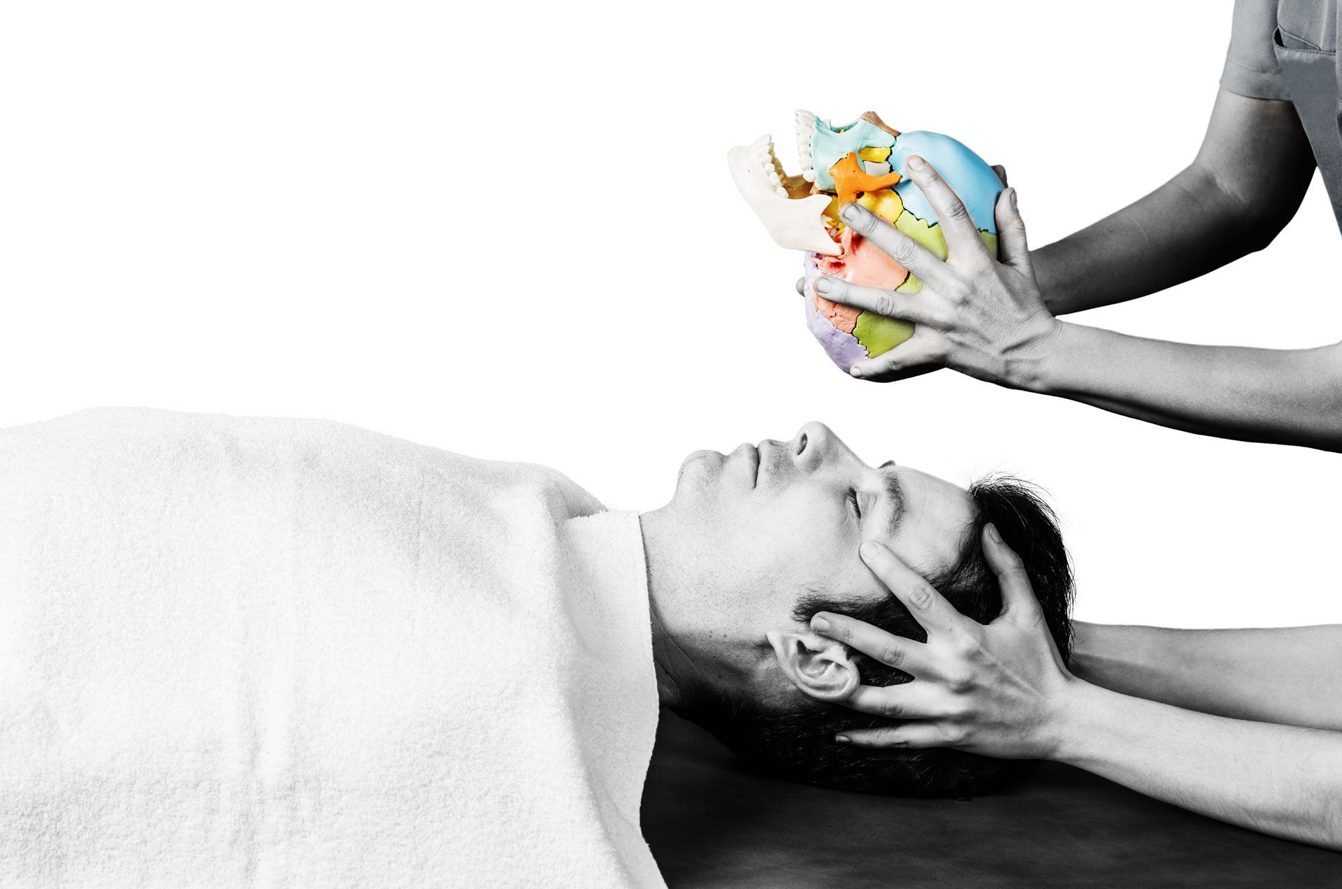 Physiotherapist Doing a Cranial Sacral Therapy