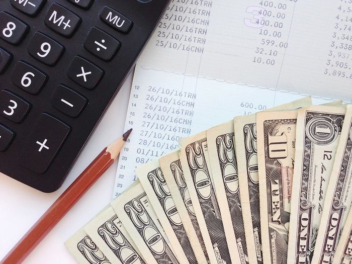 calculator and pencil in the table
