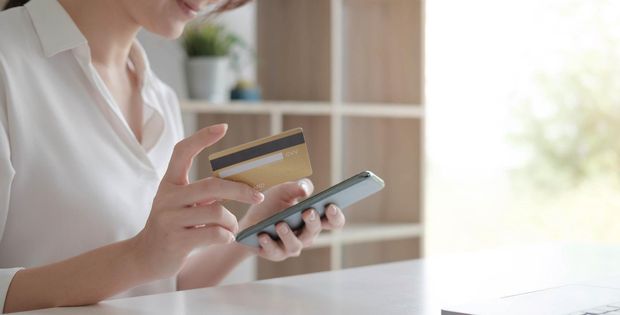 woman holding a mobile phone