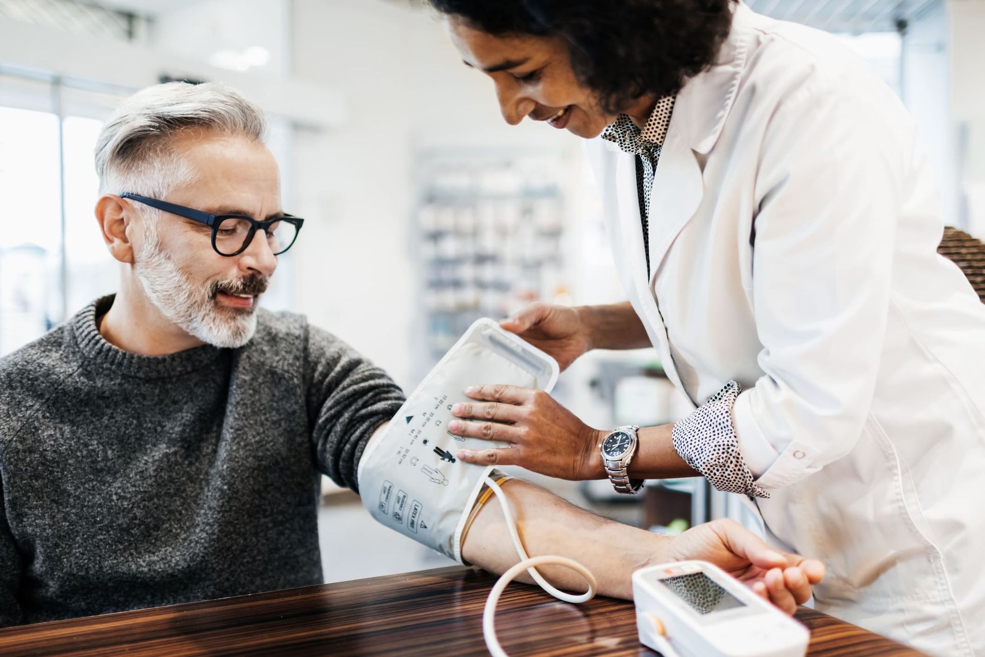 A female doctor examines a patient