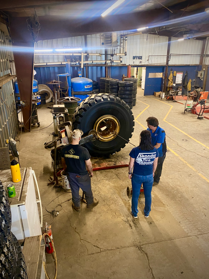 Mechanic Plugging at Skander Tire & Auto Service - Evans City Tire Service