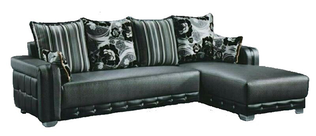A black sectional couch with striped pillows on a white background