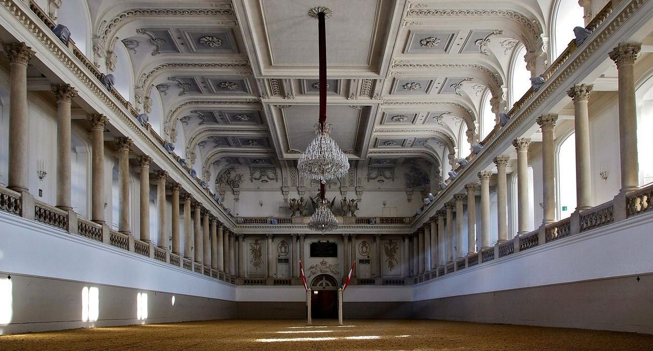 Baroque indoor arena of the Spanish Riding School in Hofburg Palace, Vienna