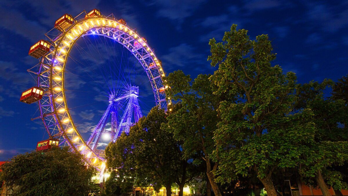 Giant Ferris Wheel at Vienna’s Prater park lit with colorful lights at night
