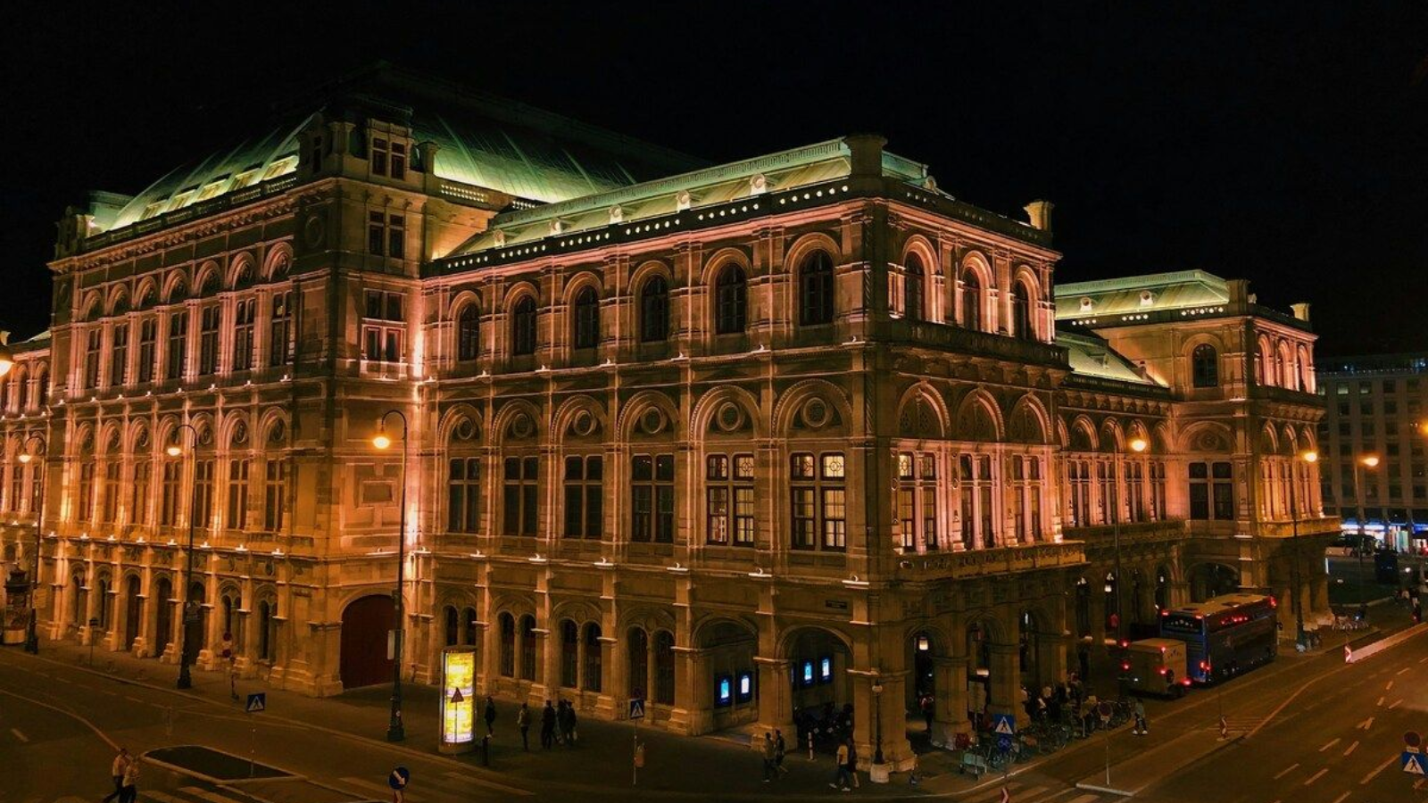Vienna State Opera at night with golden lights