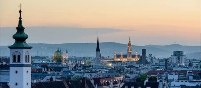 Sunset view over Vienna with Rathaus (City Hall) and city skyline