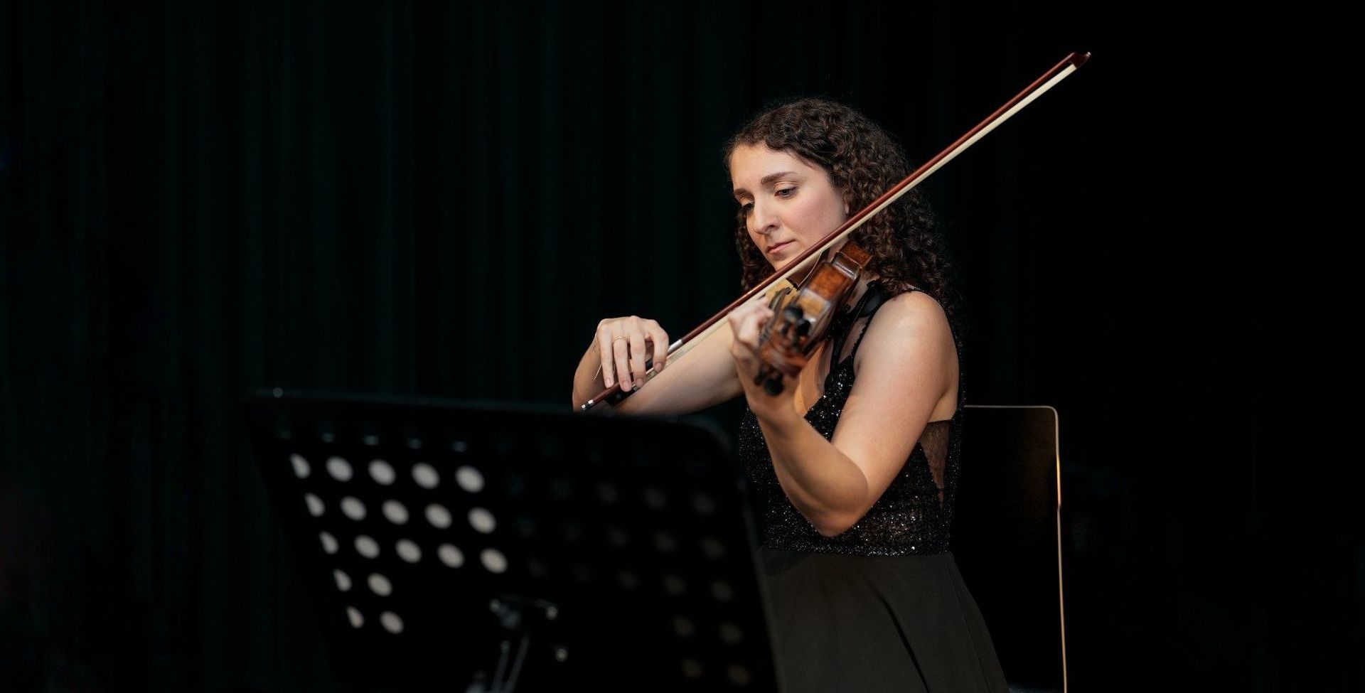 Female violinist performing at Mozart & Beethoven concert in Vienna at Haus der Musik
