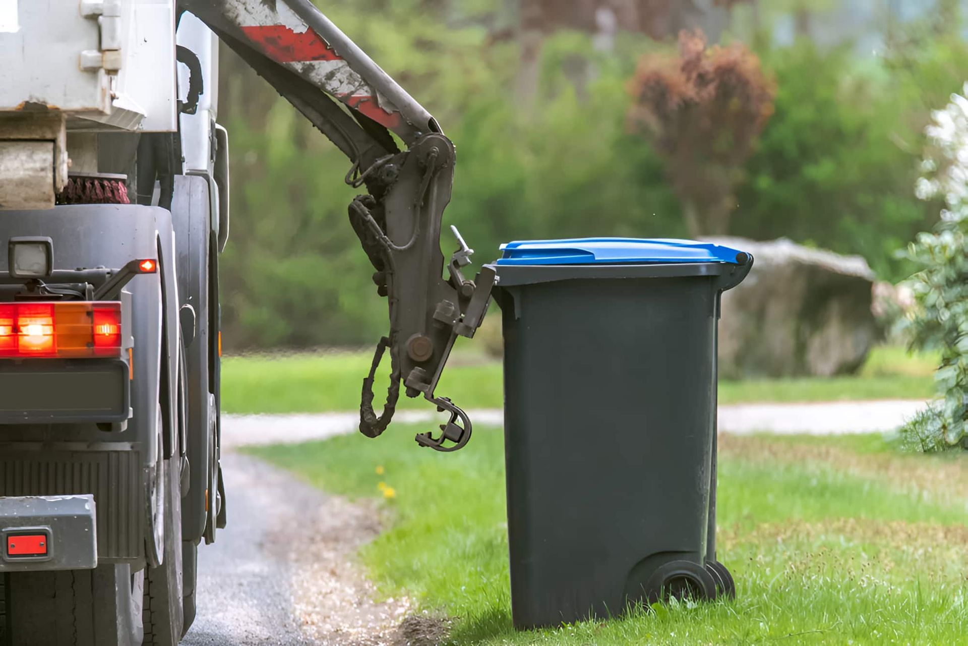 A Garbage Truck Is Loading A Garbage — Fat Boy Skips Townsville In Nome, QLD