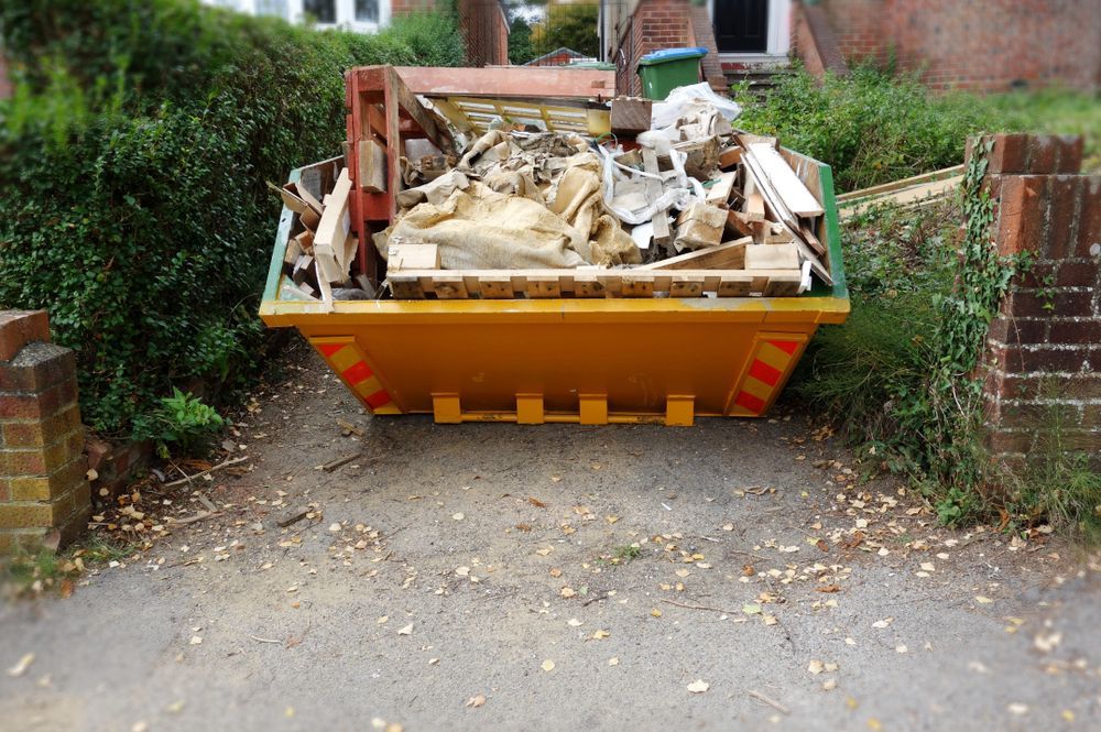 Yellow Dumpster Overflowing With Construction Debris — Fat Boy Skips Townsville In Annandale, QLD
