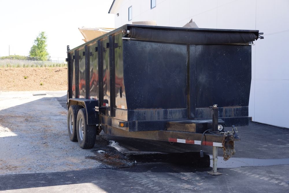 Black Dump Trailer on Pavement, Likely for Construction Debris — Fat Boy Skips Townsville In Kelso, QLD