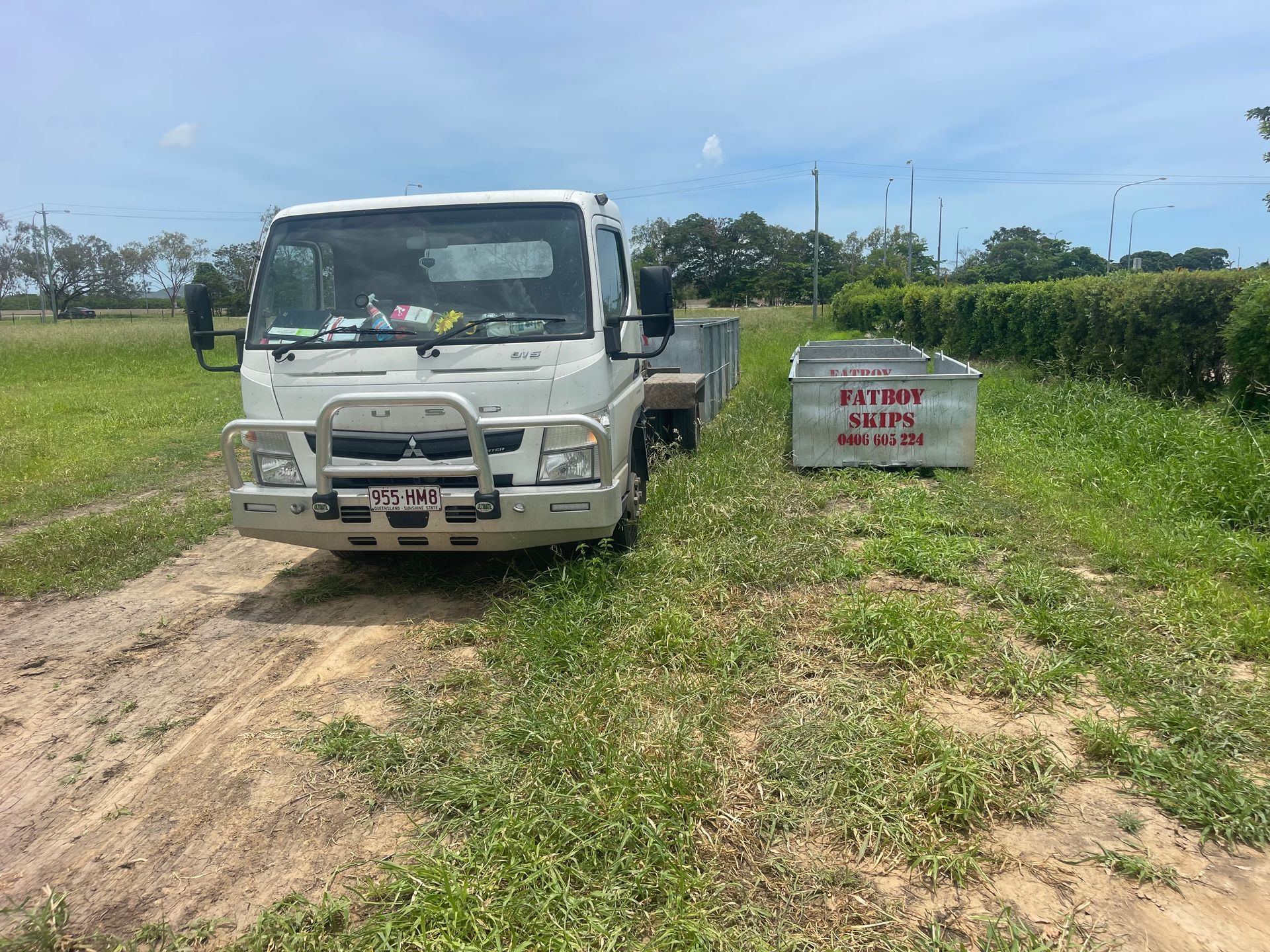 A Container Filled with Broken Red Bricks and Debris — Fat Boy Skips Townsville In Nome, QLD
