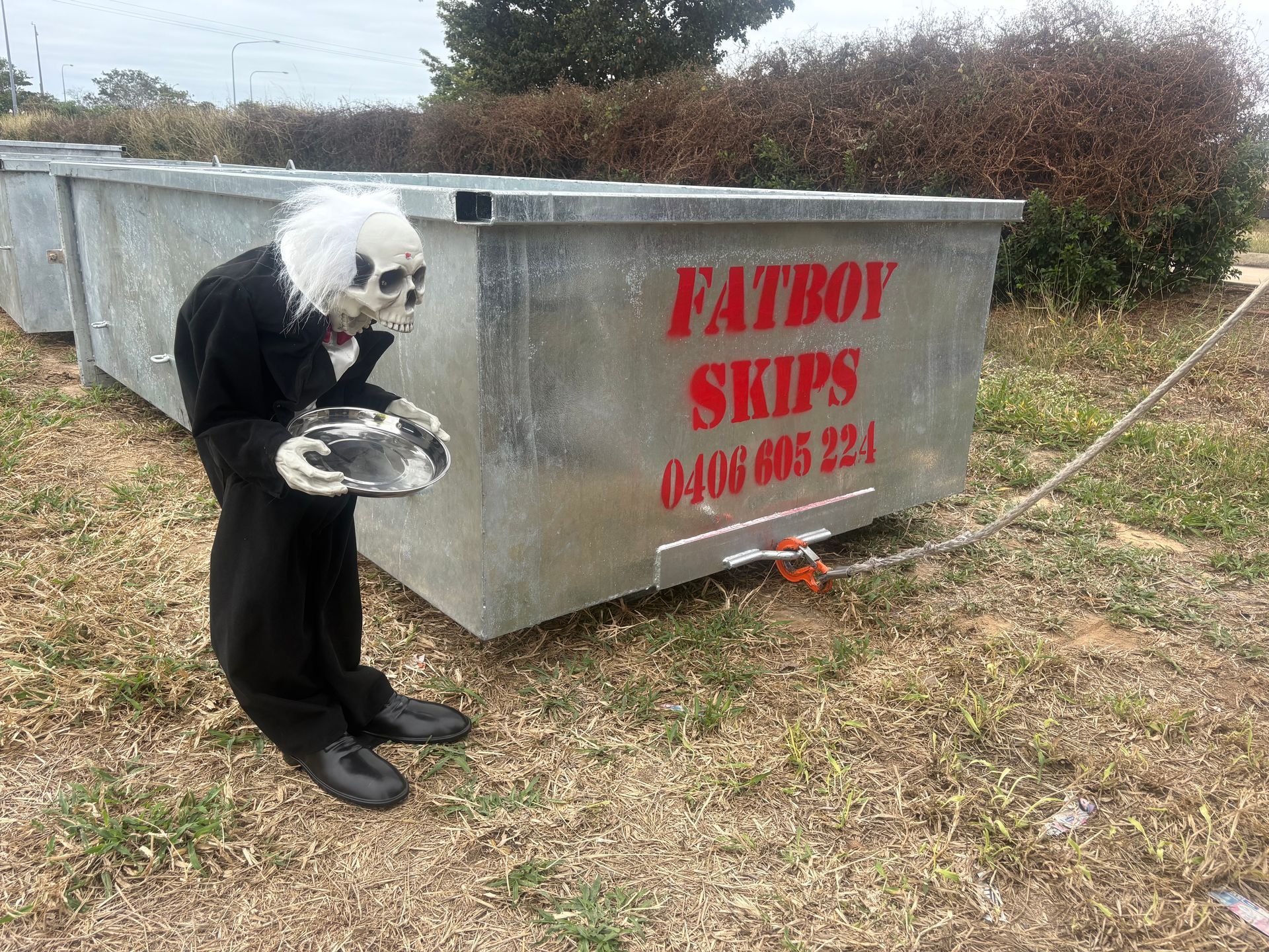 Gray Metal Dumpster Filled with Broken Asphalt and Concrete — Fat Boy Skips Townsville In Nome, QLD