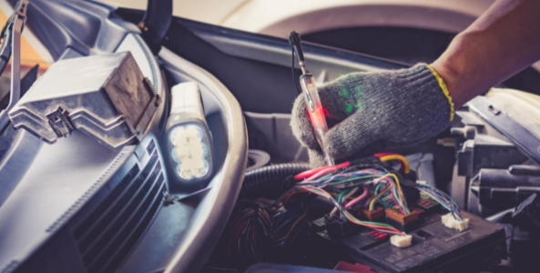 Auto Electrician testing lights Pialba Auto Electrics