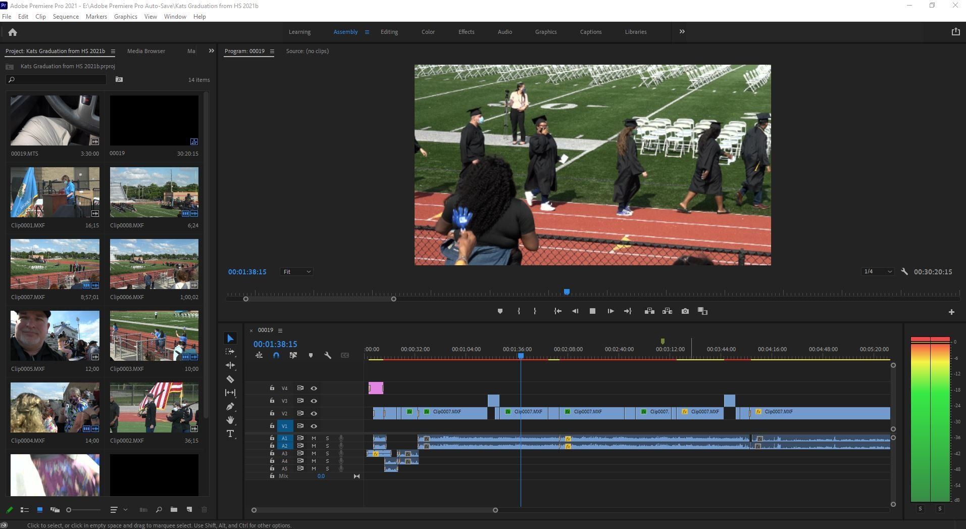 A computer screen shows a group of people walking on a track.