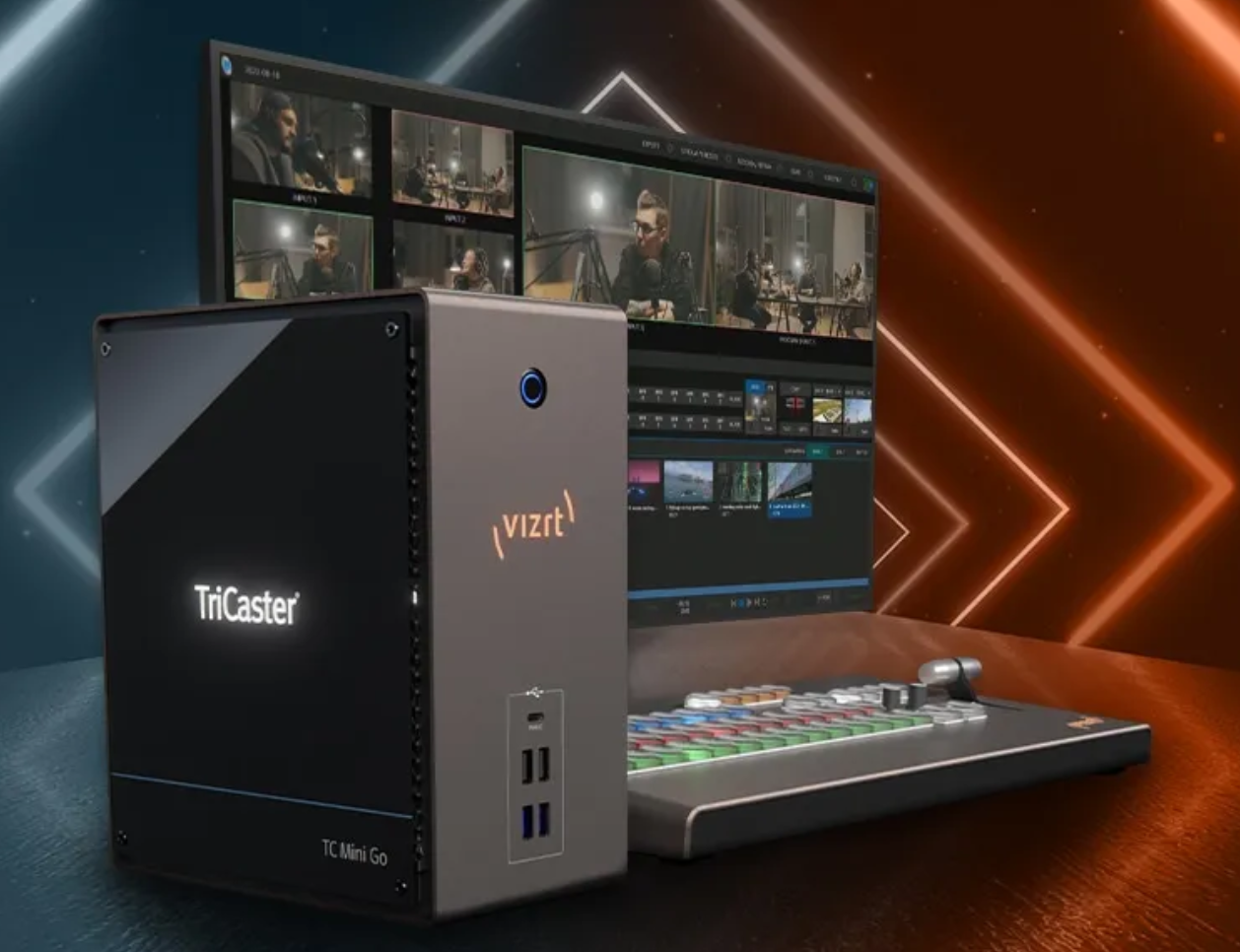 A tricaster box sits next to a laptop