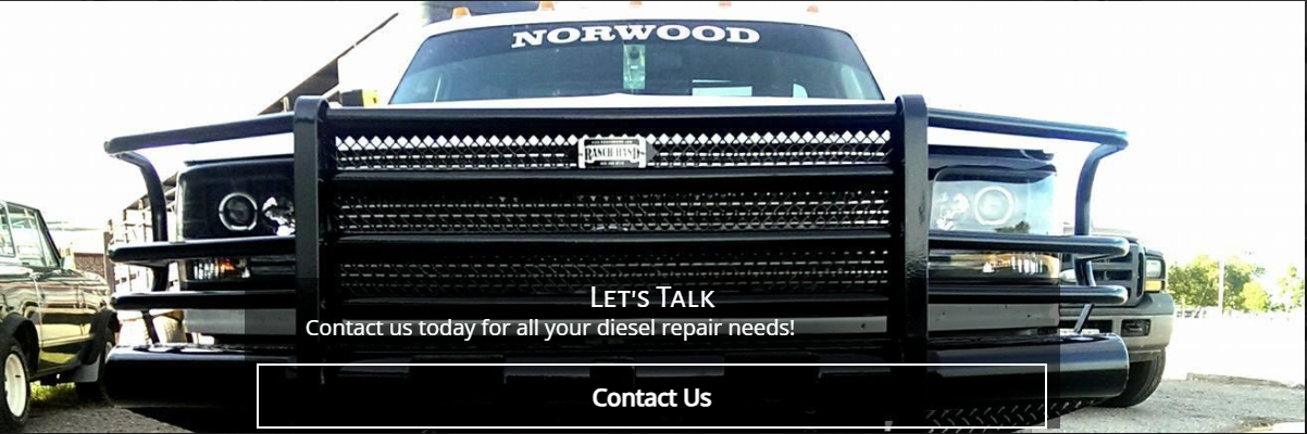 Front view of a truck with a large black grille guard, with the text