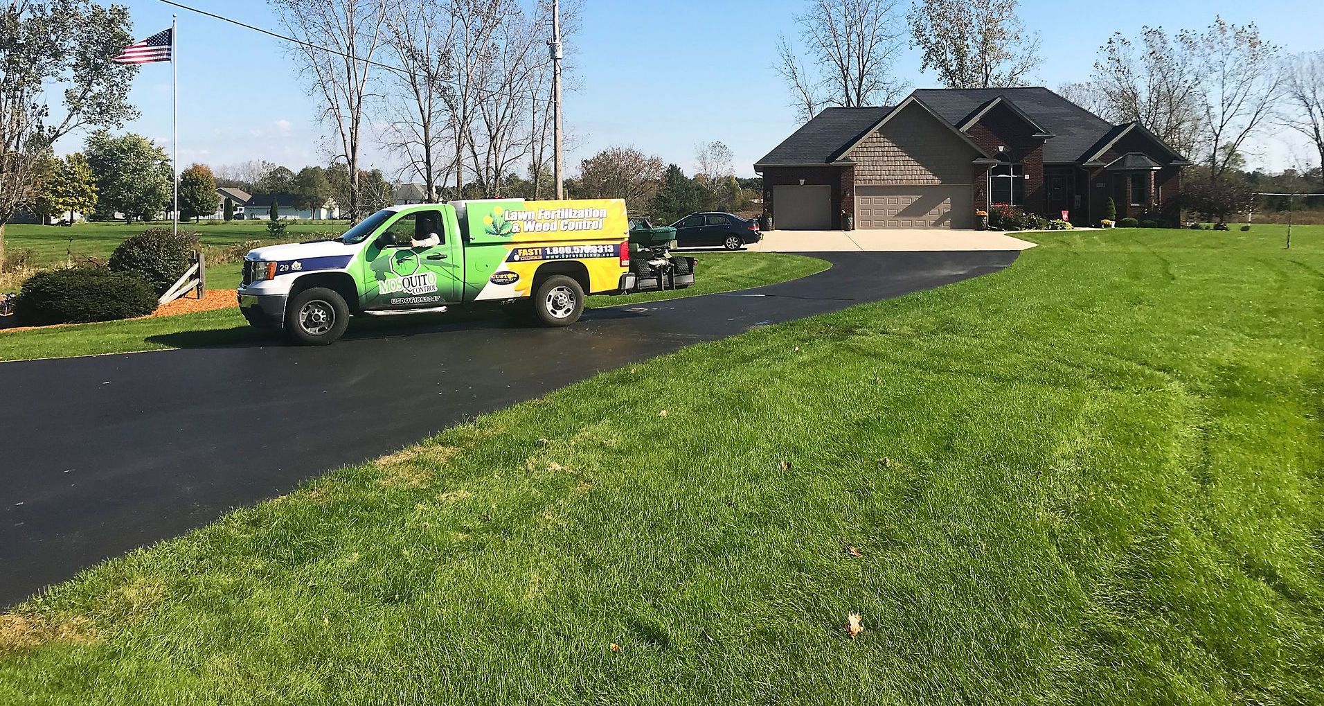 Custom Lawn Care Truck at customer property for service
