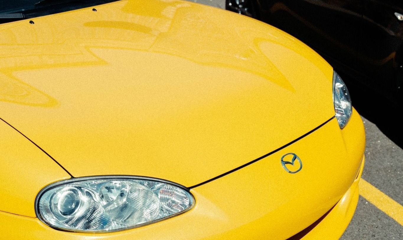 ceramic coated yellow vehicle under the sun
