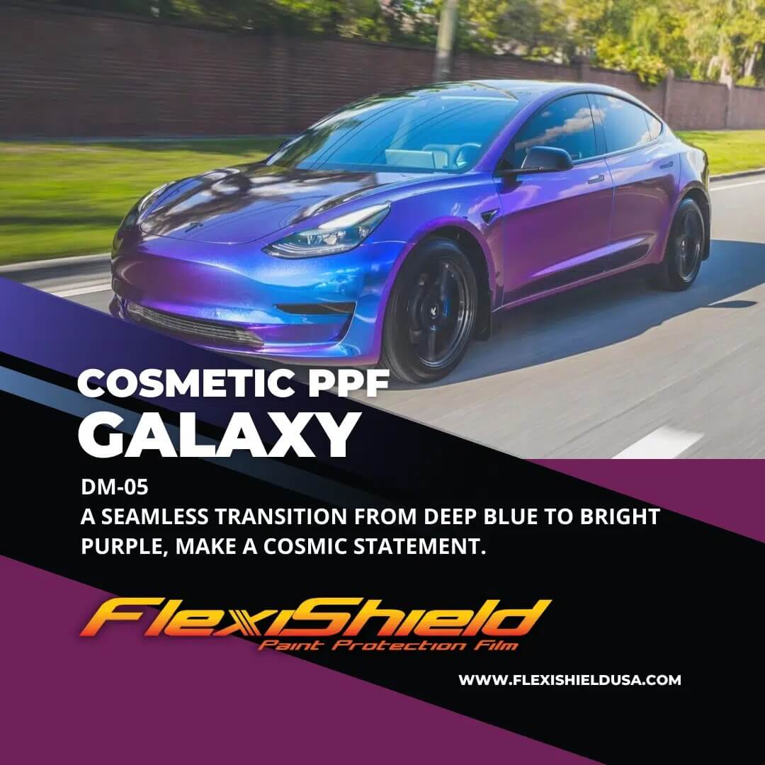 A purple car is driving down a road.
